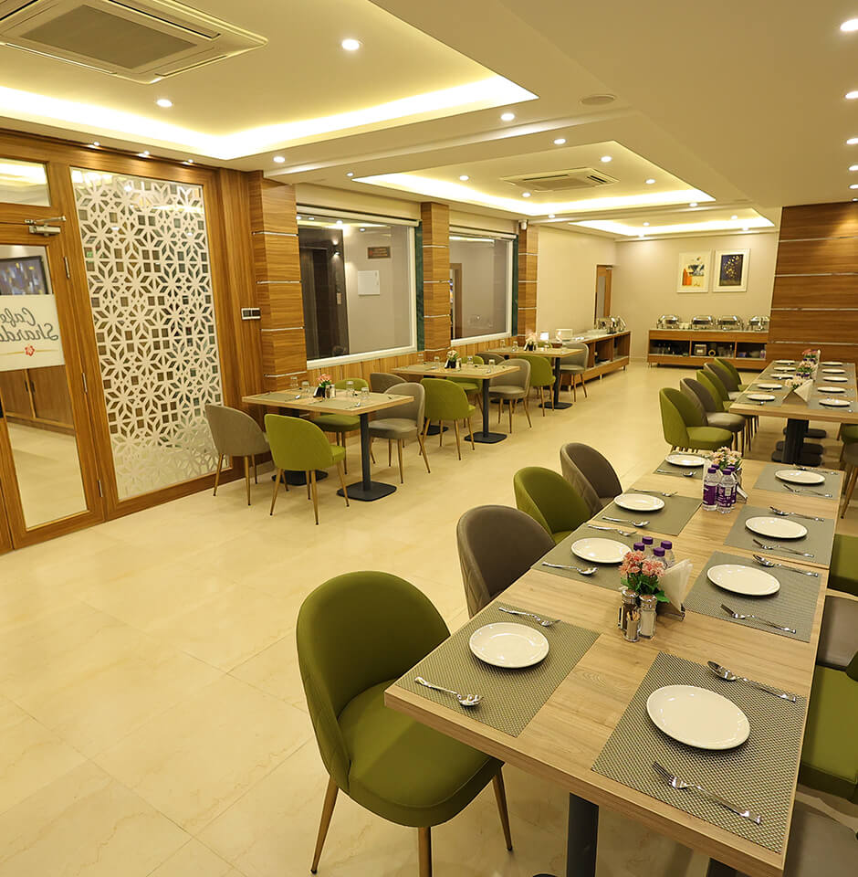 Cozy dining setup at Sharda Residency restaurant