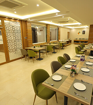 Elegant dining setup at Sharda Residency restaurant