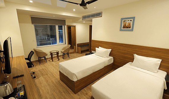 Deluxe room with elegant décor at Sharda Residency