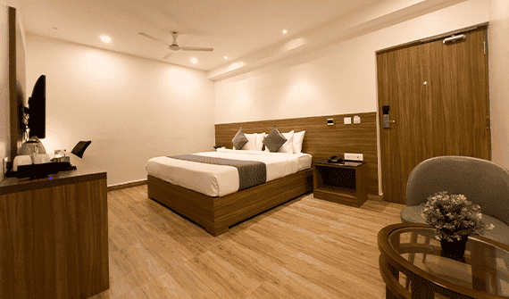 Deluxe room with elegant décor at Sharda Residency