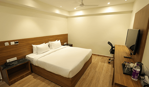 Executive room with modern furnishings at Sharda Residency